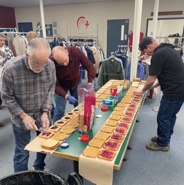 A Group of Volunteers Making Sandwiches for the Homeless